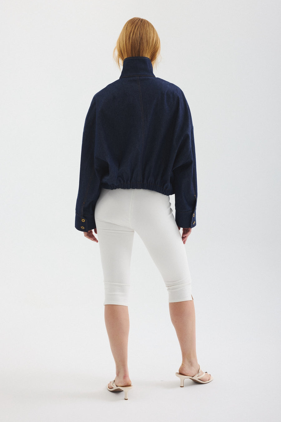 Model showing back of Blue Jay jacket in Indigo