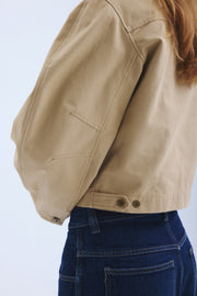 Detail of stitching on arm of sand colored Palmetto jacket