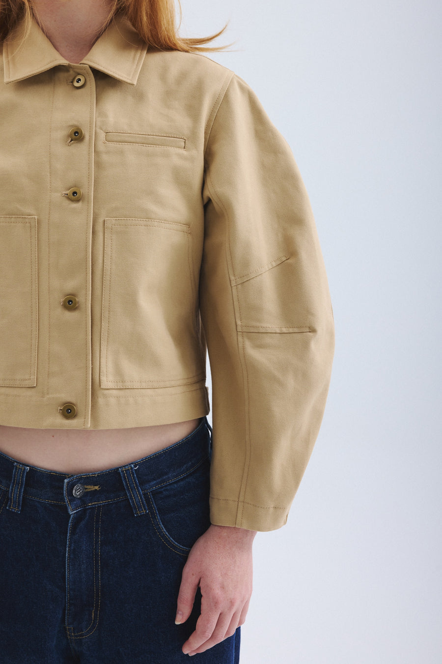 Detail of stitching and pockets of sand colored Palmetto jacket